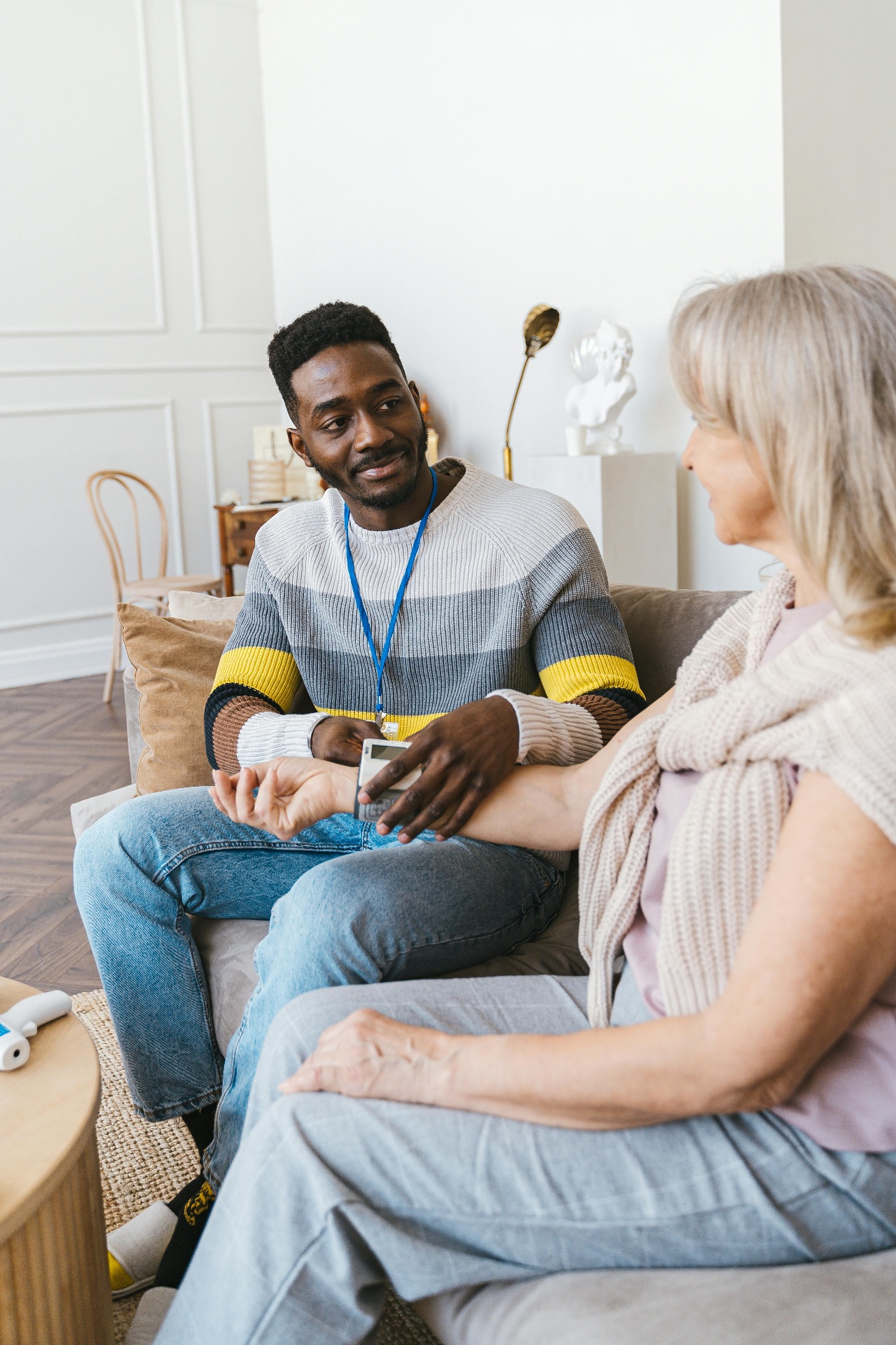 Nurse chatting with senior woman